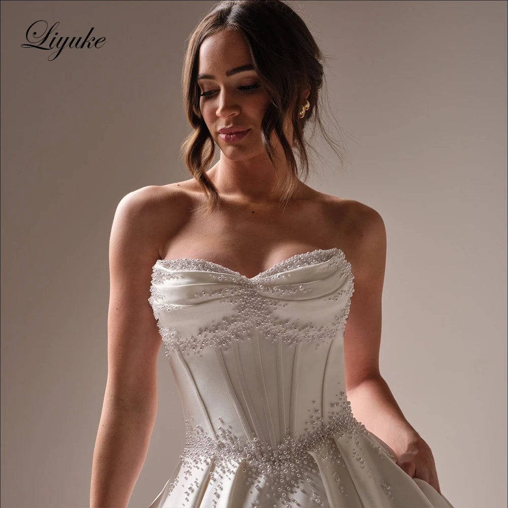 Liyuke Custom Made Beading Pearls Princess A-Line Wedding Dresses Sweetheart Bridal Gowns With Removable Bow